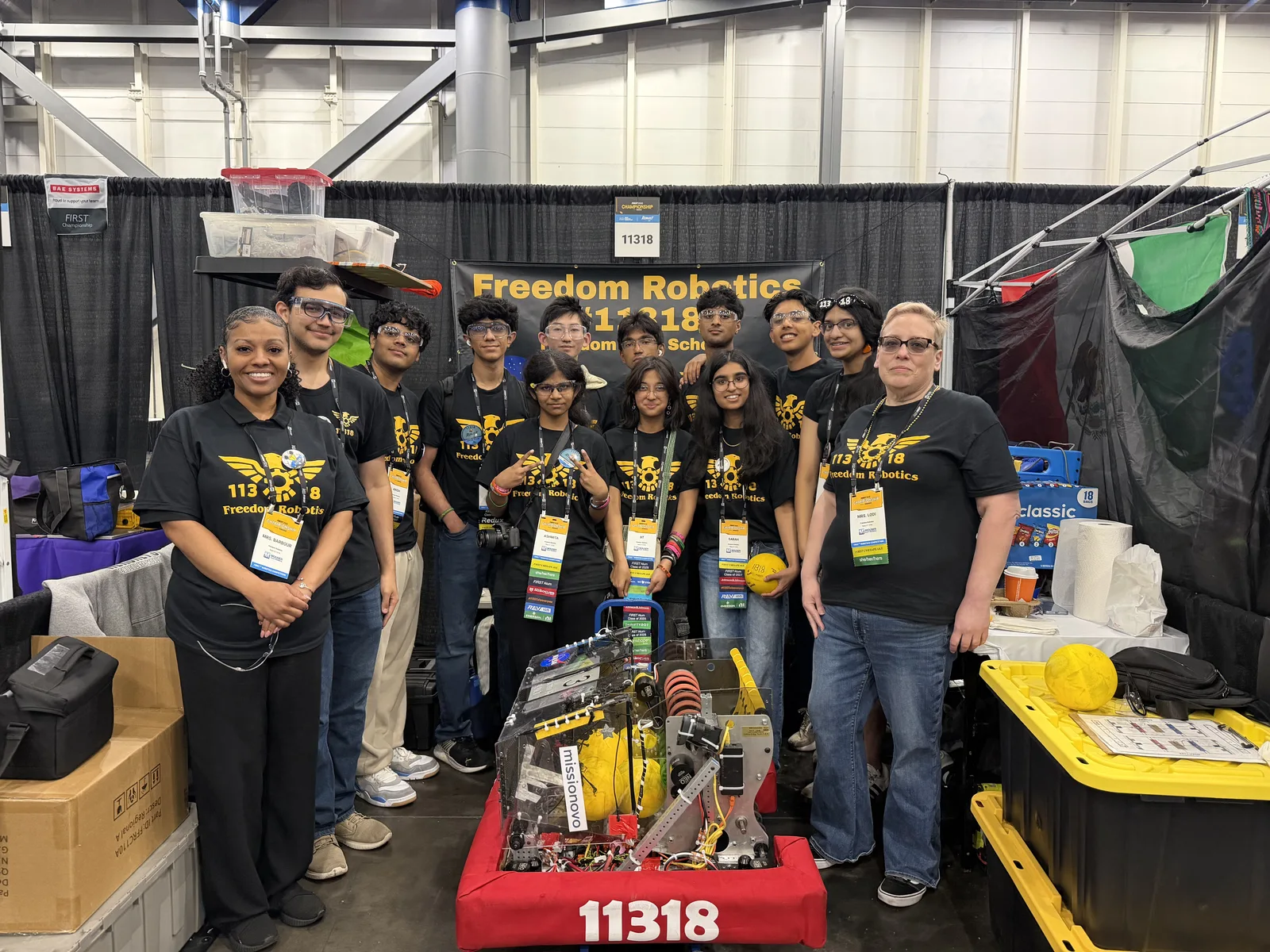 Team members with their robot in the competition pit