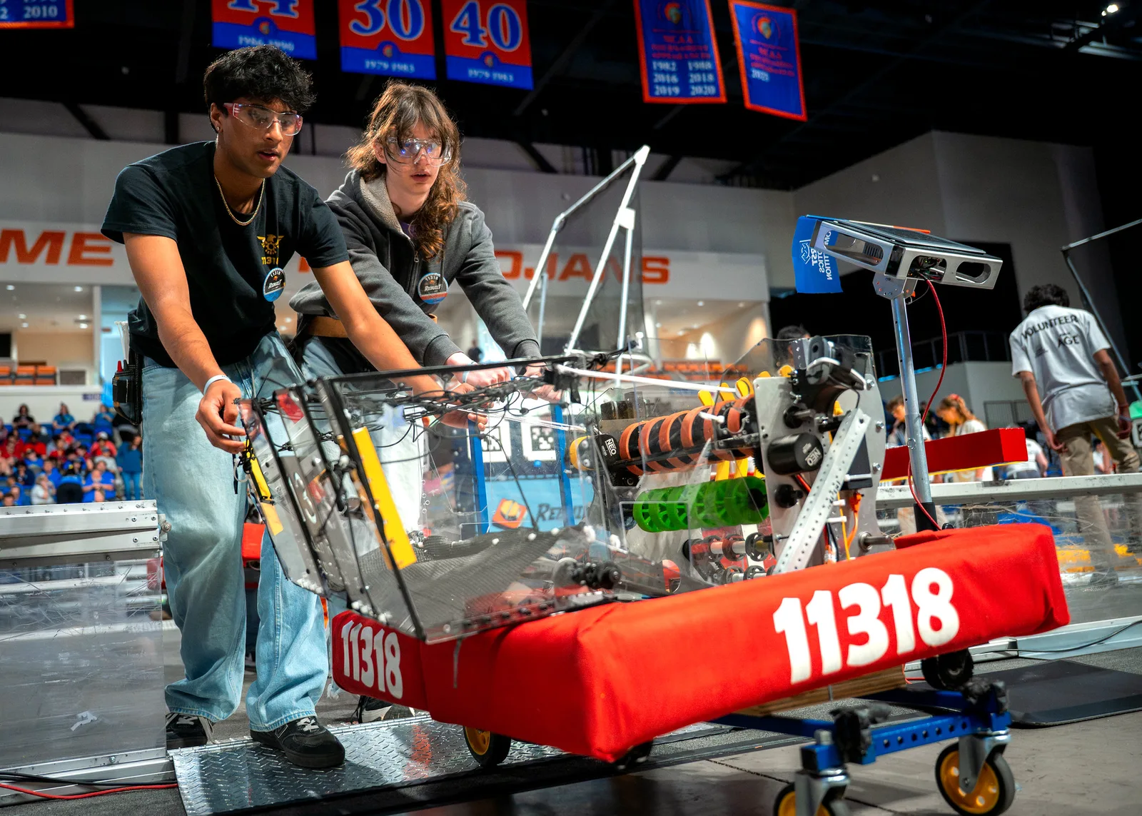 Freedom Robotics students with robot 11318 at a FIRST competition
