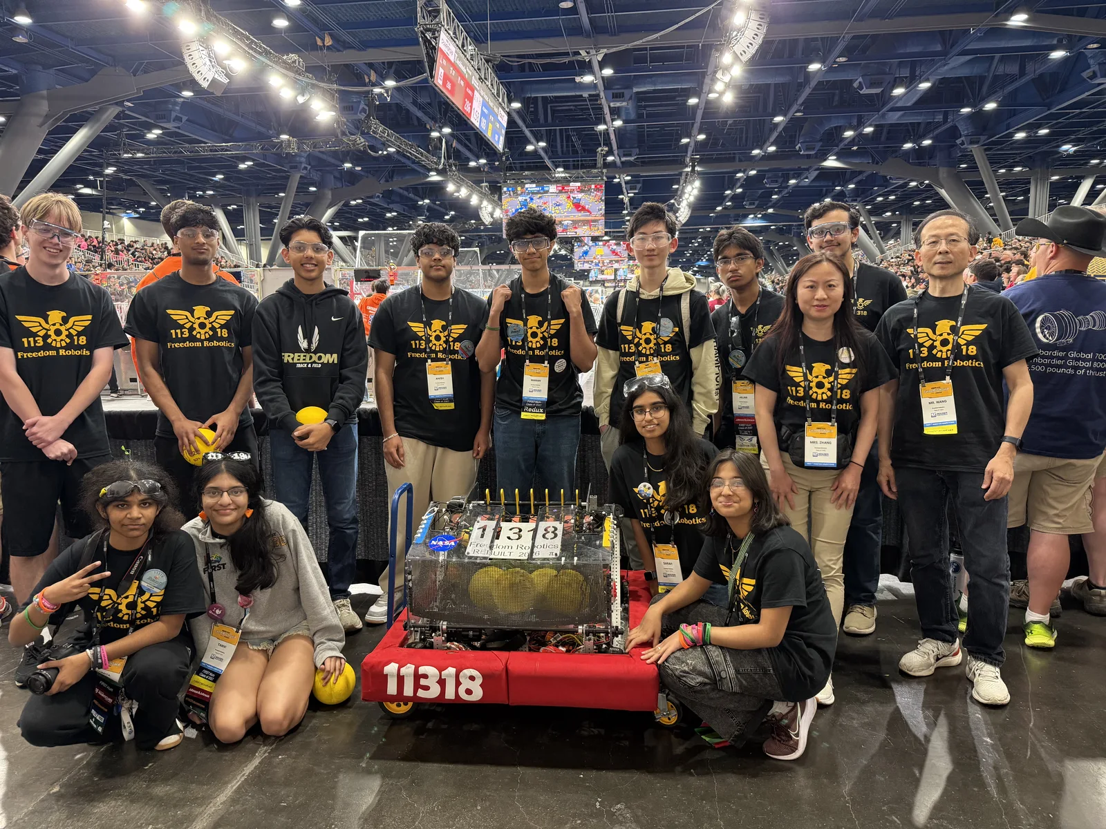Freedom Robotics team gathered with their robot at the FIRST Championship